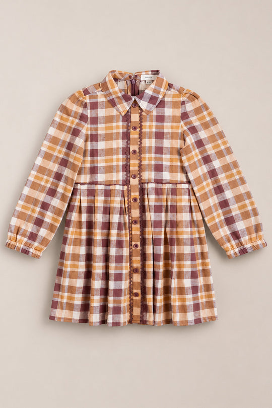 The Mini Bowie Long Sleeve Dress in Spiced Plaid by Ivy City Co features a vibrant orange, brown, and white plaid pattern with balloon sleeves, a classic collar, and a gathered waist—crafted from soft cotton dress fabric and shown against a plain beige background.