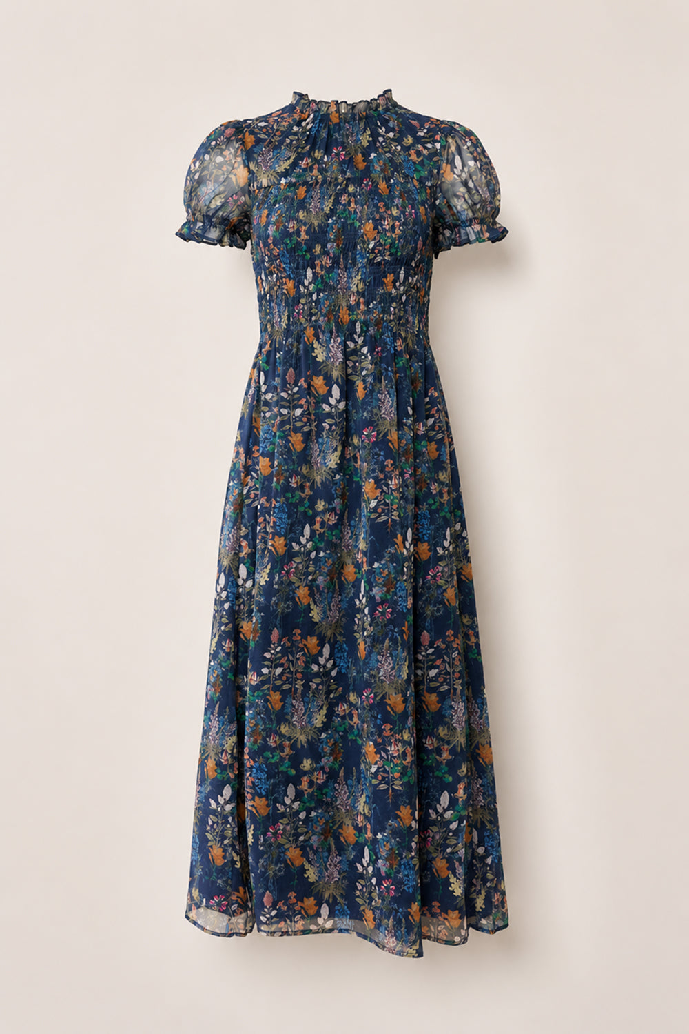 The Leonora Dress in Midnight Autumn Bouquet by Ivy City Co is a navy blue, midi-length dress featuring a floral print, smocked bodice, ruffled high neckline, and sheer puff short sleeves. Displayed against a light background, this versatile piece is also maternity friendly.