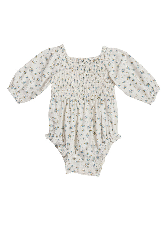The Ivy City Co Baby Madeline Romper in Blue features long puffed sleeves, a square neckline, blue floral print, elastic leg openings, and crotch snaps—perfectly comfortable and ideal for your little one’s Easter outfit.