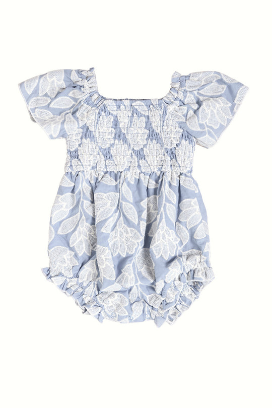 The Baby Ophelia Romper in Mosaic Embroidery by Ivy City Co features light blue fabric, short ruffled sleeves, a smocked bodice, and elastic leg openings—perfect for infants and Mom and Me matching looks.
