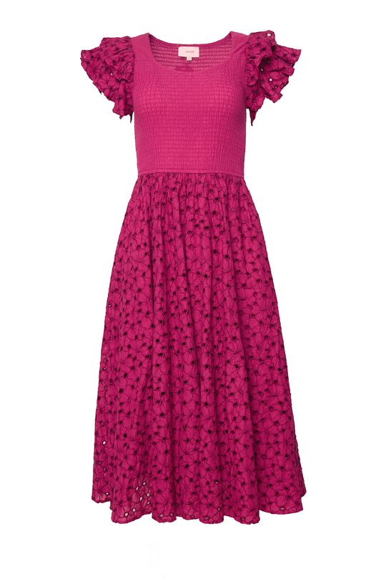 The Hattie Dress in Magenta by Ivy City Co is a midi maternity-friendly dress with a smocked bodice, ruffled short sleeves, a floral lace overlay skirt, round neckline, and fitted waist for effortless elegance.