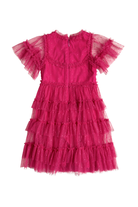 The Ivy City Co Mini Whimsical Dress in Fuchsia features layered ruffled tulle, sheer sleeves, and tiny polka dots, shown from the back against a white background.