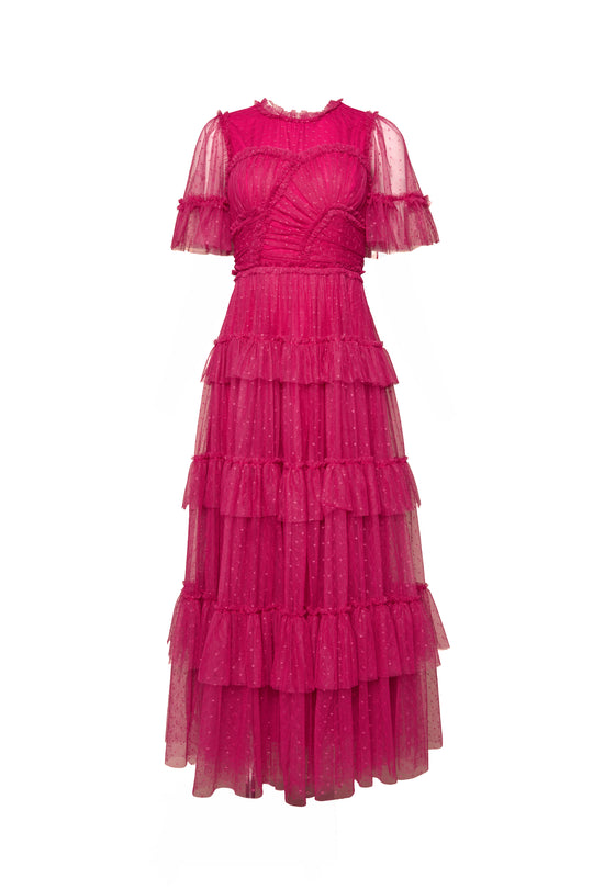 The Whimsical Dress in Fuchsia by Ivy City Co features short sheer sleeves, a fitted bodice, and a tiered tulle skirt crafted from delicate dotted mesh with subtle pleats for an elegant touch.