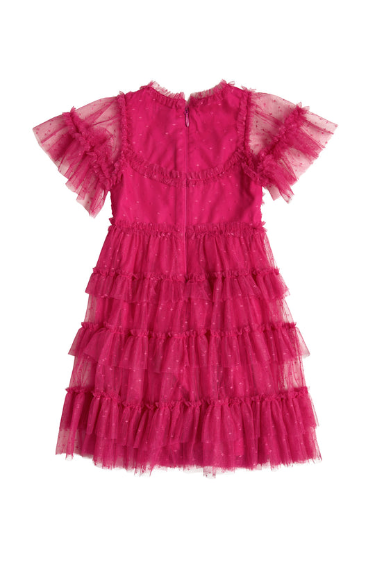 The Ivy City Co Mini Whimsical Dress in Fuchsia is a bright pink dress for children, featuring a layered tulle skirt, polka dot mesh, frilled neckline, delicate transparent flutter sleeves, and a back zipper.