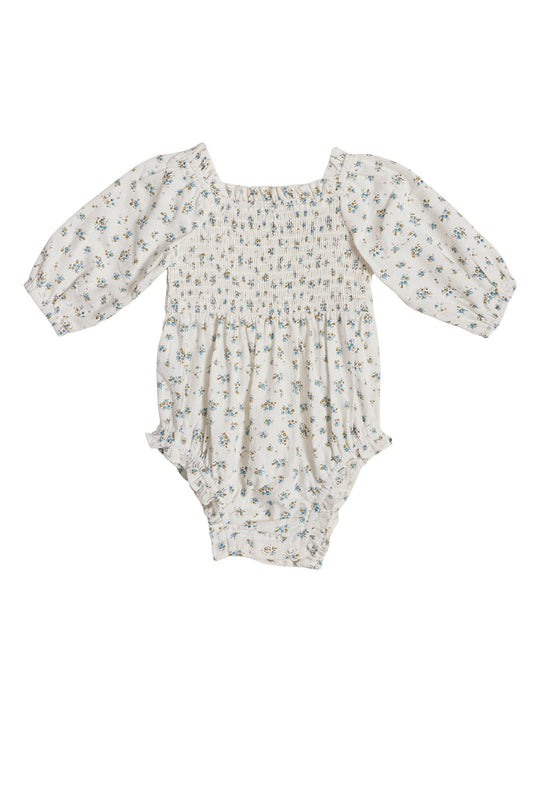 The Ivy City Co Baby Madeline Romper in Blue features a white long-sleeve design with a square neckline, smocked bodice, ruffled leg openings, and an allover blue and green floral print, shown on a white background—a charming choice for an Easter outfit.