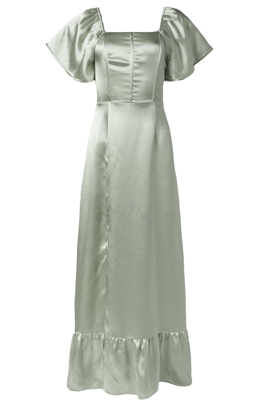 The Maddie Dress in Sage Satin by Ivy City Co features a light sage green satin fabric, short flutter sleeves, and a square neckline with a fitted bodice reminiscent of classic corset-style bridesmaid dresses. The long skirt gracefully flows to a ruffle hem, while the smooth satin finish gives this maxi event dress an elegant and formal look.
