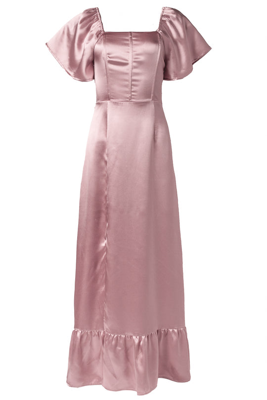 The Maddie Dress in Blush Satin by Ivy City Co is a long bridesmaid dress with short flutter sleeves, a square neckline, a fitted bodice, and a ruffled hem.