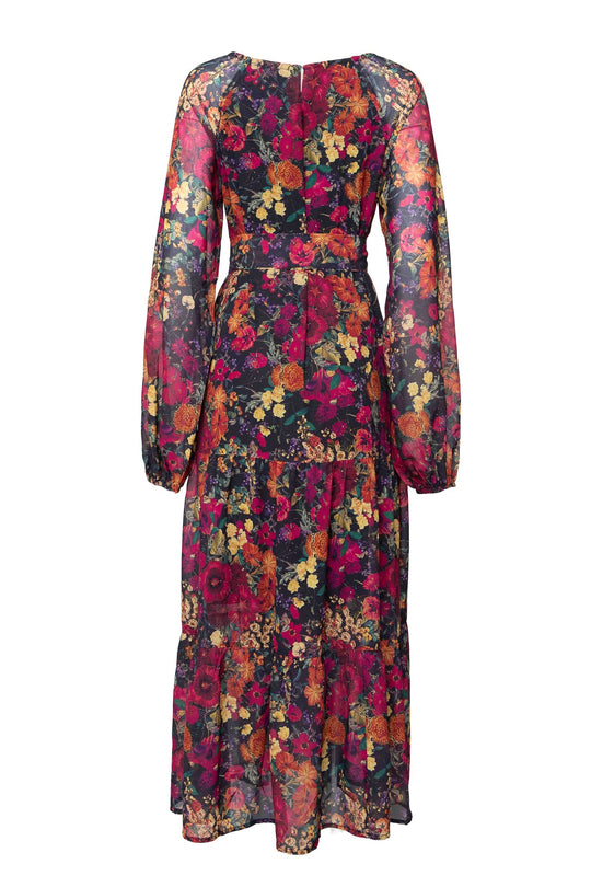 The Imogen Dress in Night Garden by Ivy City Co is a long-sleeved, ankle-length maxi dress featuring a fitted waist and a multicolored floral pattern on sheer fabric, shown from the back.